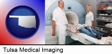 a magnetic resonance imaging machine with a technician, nurse, and patient in Tulsa, OK